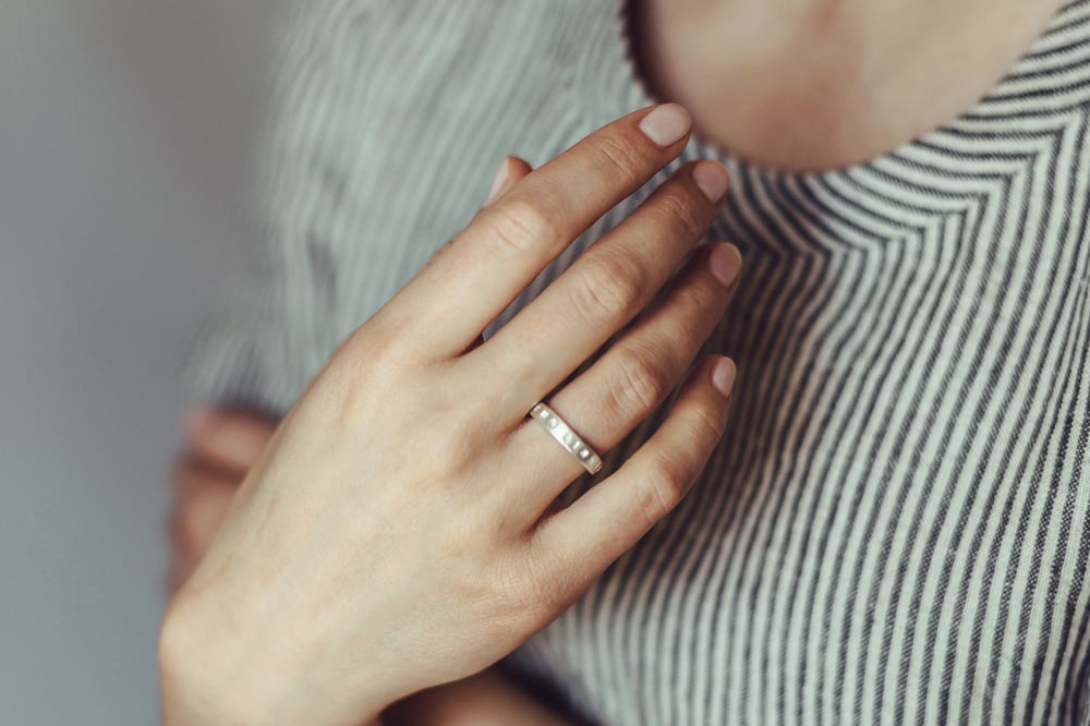 Image of silver thin ring with inscription in Latin