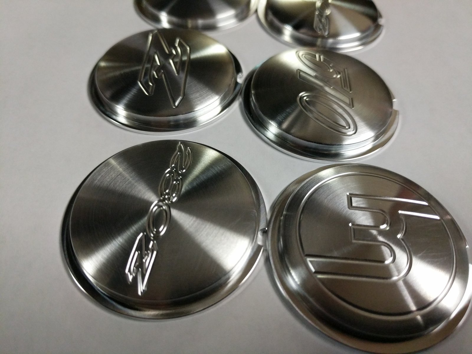 Custom aluminum Momo horn button coin | MachinedSpeed