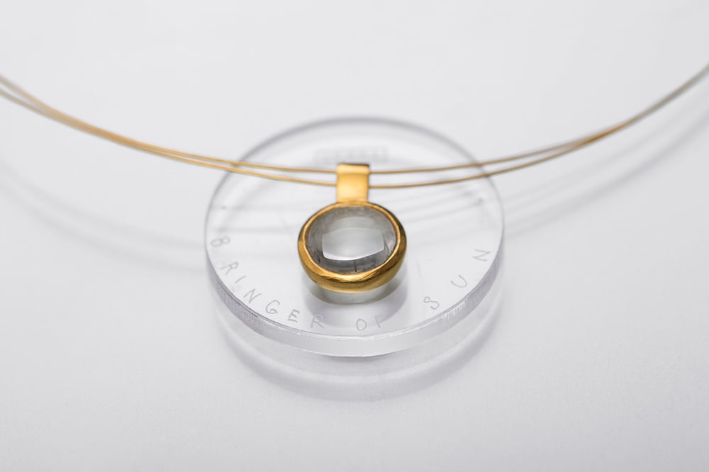 Image of "Bringer of the sun" gold plated silver pendant with rock crystal · SOLIFER ·