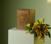 Image of Large bronze urn with small cross
