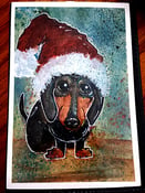 Image of Dachshund in a Santa Hat