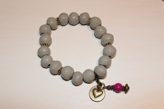 Image of Light grey with charm
