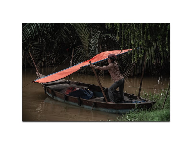 Image of Vietnamese woman on boat