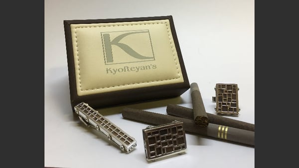 Image of Cufflink and wood.