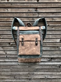 Image 2 of Waxed canvas backpack with roll up top and hand waxed leather bottom and outside pocket
