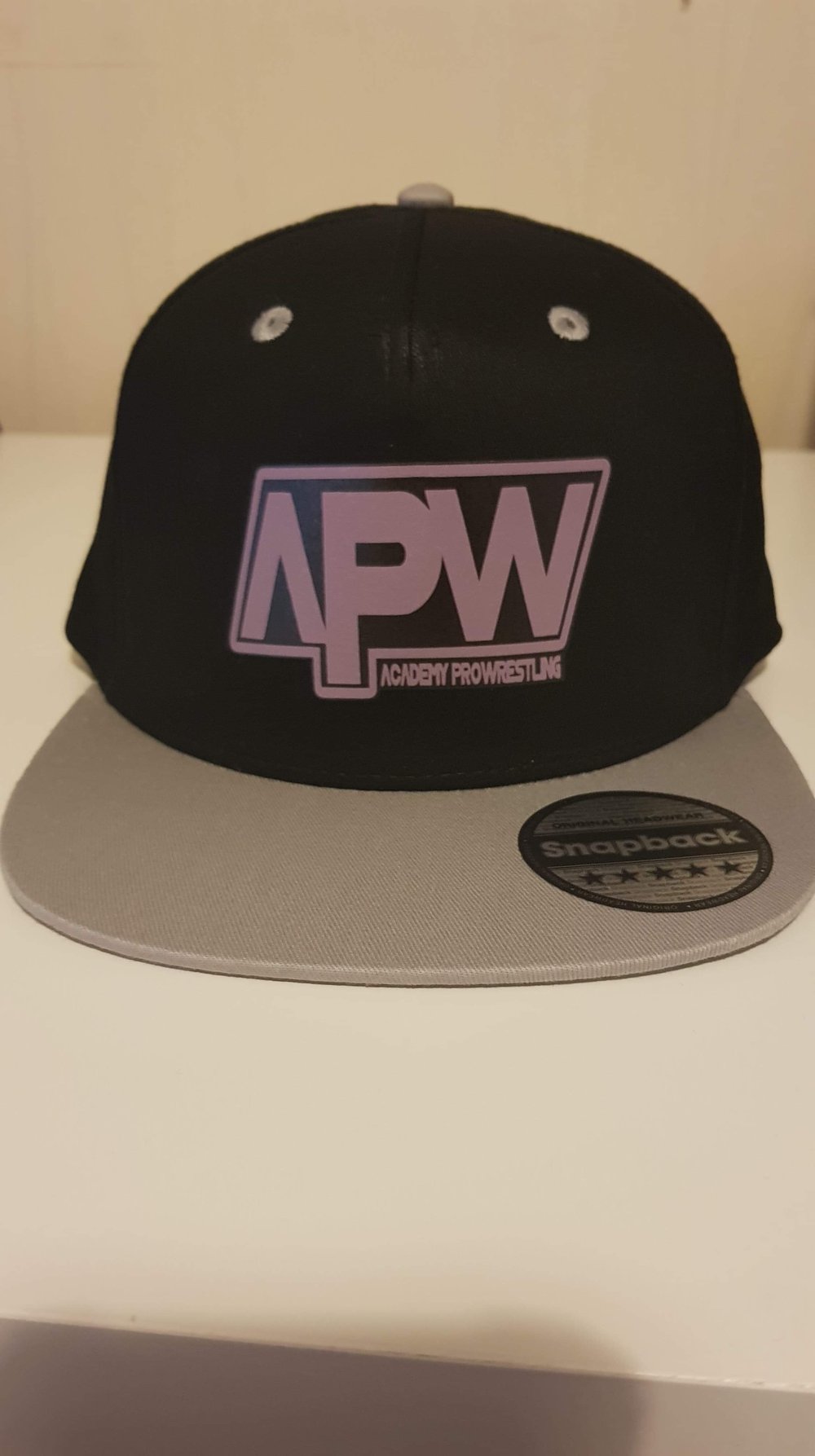 Image of APW Snap back caps