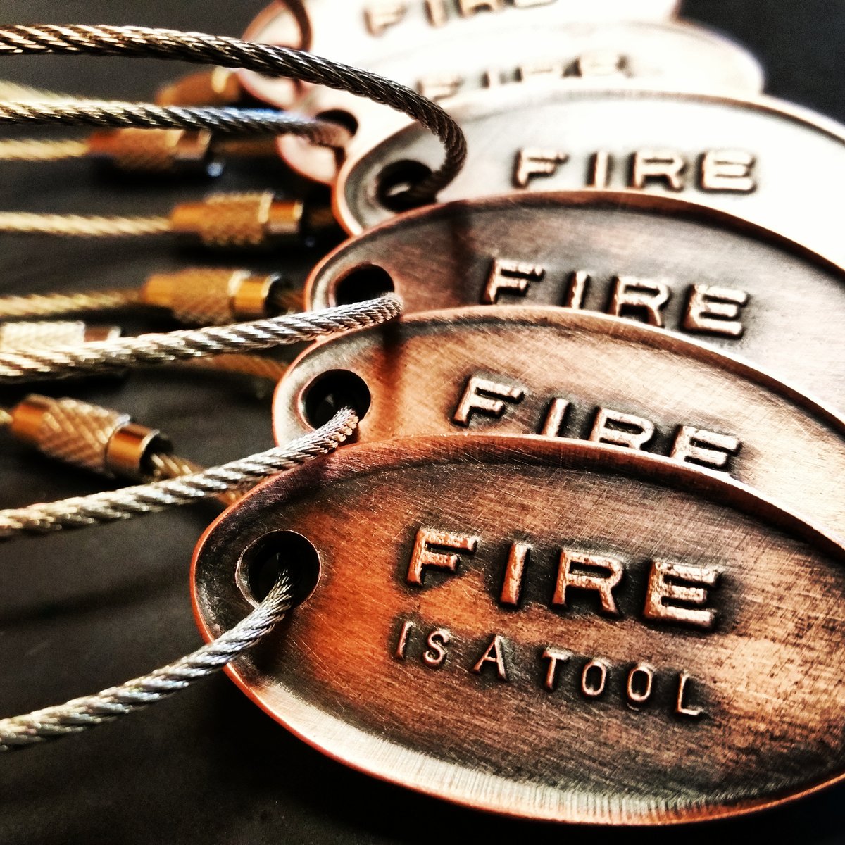 Image of KEYCHAINS-FIRE IS A TOOL
