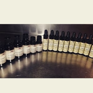 Image of SALE!  1/2 oz. certified organic ingredient Thieves oil in an amber glass dropper jar