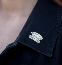 The World Goes to The Doers Enamel Pin