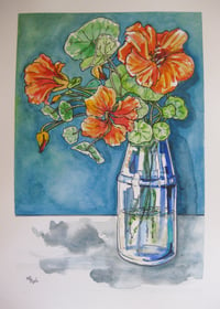 Image 3 of Orange Nastursiums in a blue glass vase