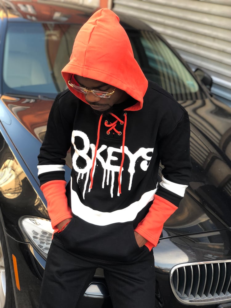 Image of 8keys Black and orange  hockey jersey hoody 