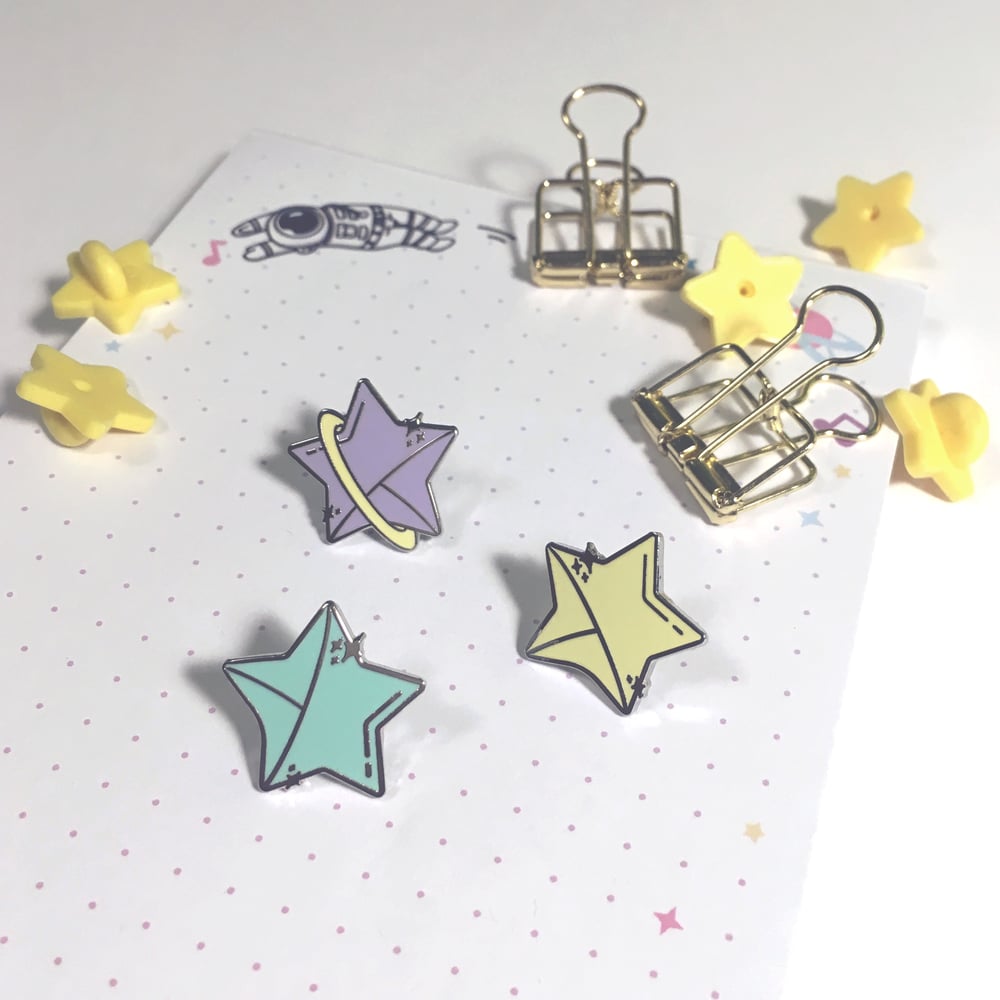 Image of cosmic stars | 0.75" enamel pins