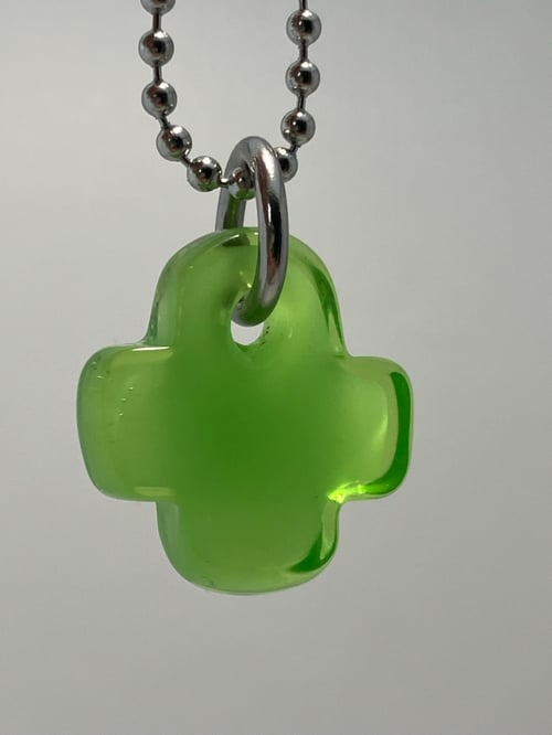 Image of green over green plus 