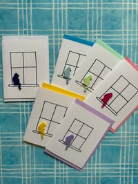 Image 1 of Cat Sitting In A Window