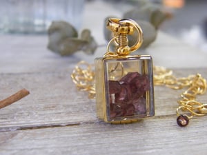 Image of Gold Floating Locket Choker Style with rough cut Umbalite Rhodolite Garnets