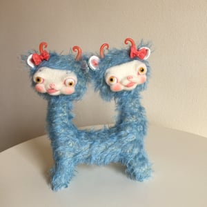 Image of Popeye and Penelope the Tiny Two-Headed yak