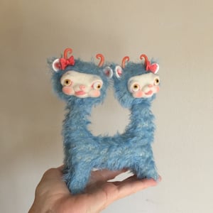 Image of Popeye and Penelope the Tiny Two-Headed yak