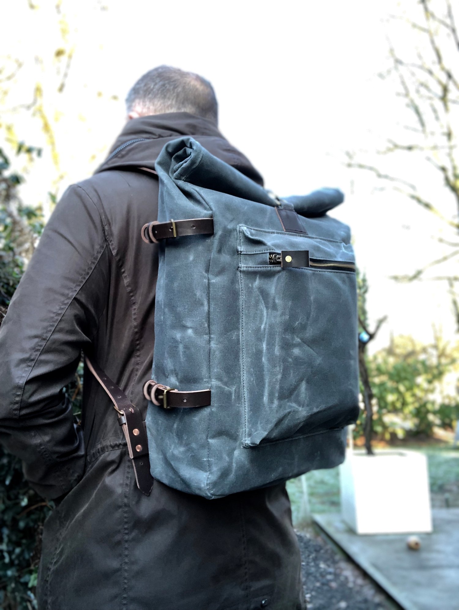 Image of  Waxed canvas backpack with roll to close top and vegetable tanned leather shoulder straps