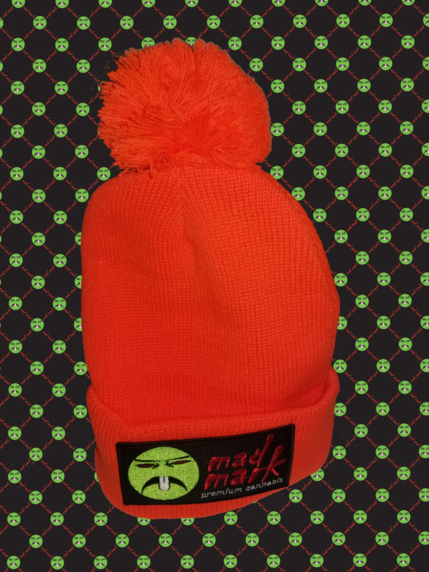 Image of puff ball patched beanie