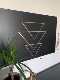 Image 1 of Gold leaf set on a black background 