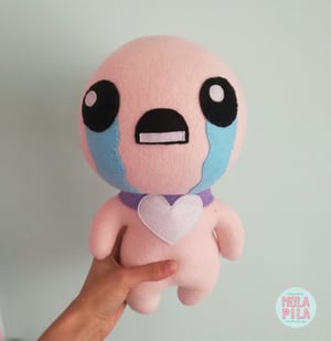 Image of Isaac toy with three accessories.