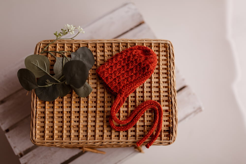 Image of Knit wrap with hat - rust