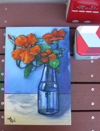 Image 4 of Orange Nasturtiums in a blue glass vase