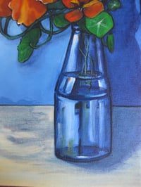 Image 3 of Orange Nasturtiums in a blue glass vase