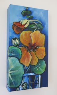 Image 2 of Nasturtiums in a glass