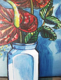 Image 2 of Red Anthuriums in a white vase