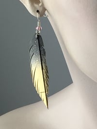 Image 1 of Sleek Gold Feather Bike Inner Tube Earrings 