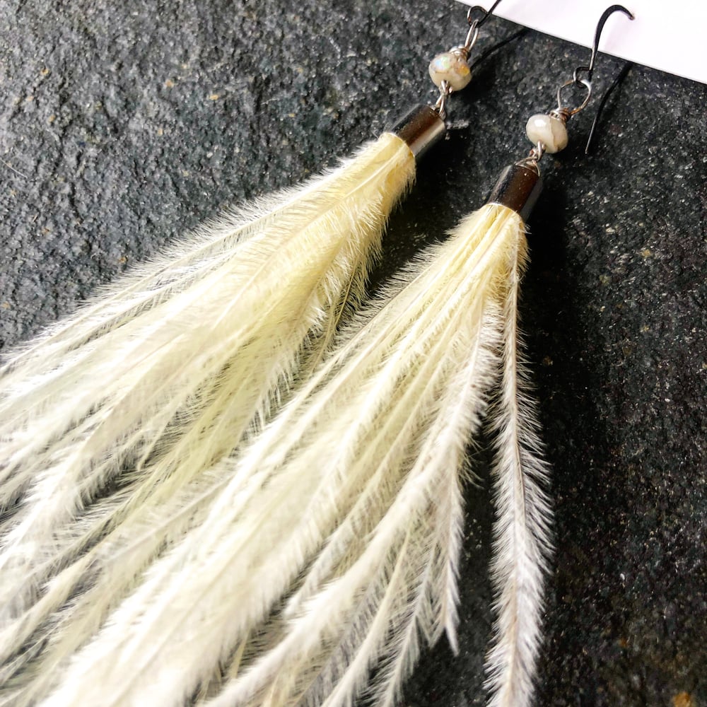 Image of White feather and aurora borealis moonstone 