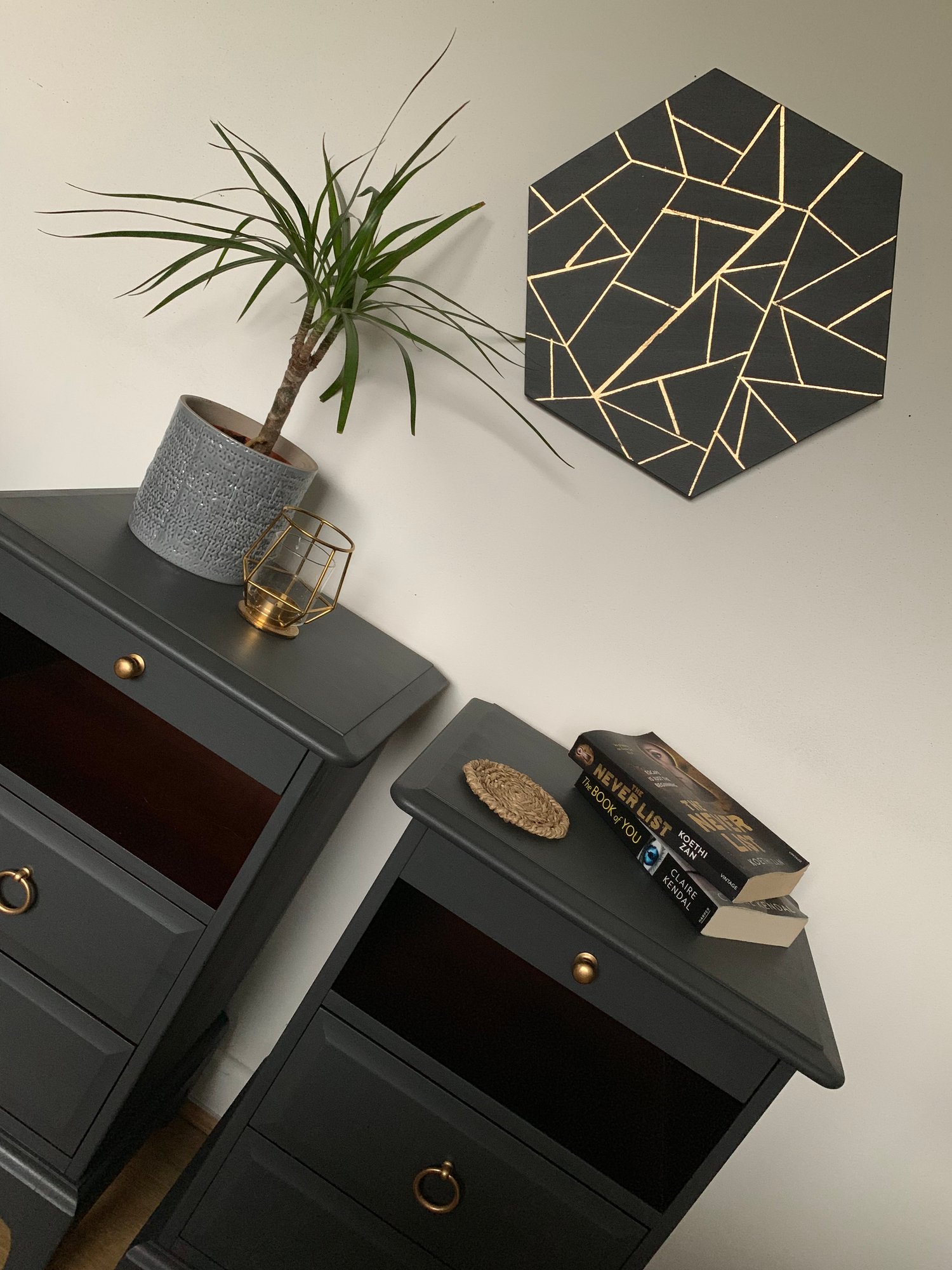 Image of A rare pair of dark grey stag & mahogany bedside tables