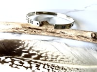 Image 3 of Luna symbol silver stamped cuff bracelet. Handmade crescent moon patterned bracelet (6mm)