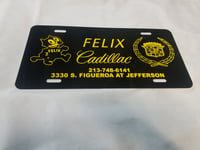 Image 1 of  Felix Cadillac aluminum license plate lowrider dealership