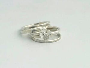 Image of Silver stacking rings with flower
