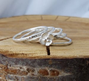 Image of Silver stacking rings with Buttercup flower