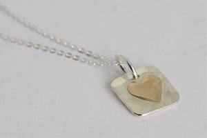 Image of Silver square hammered pendant with gold heart