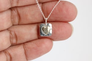 Image of Silver square hammered pendant with gold heart