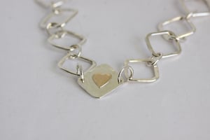 Image of Silver square hammered bracelet with gold heart