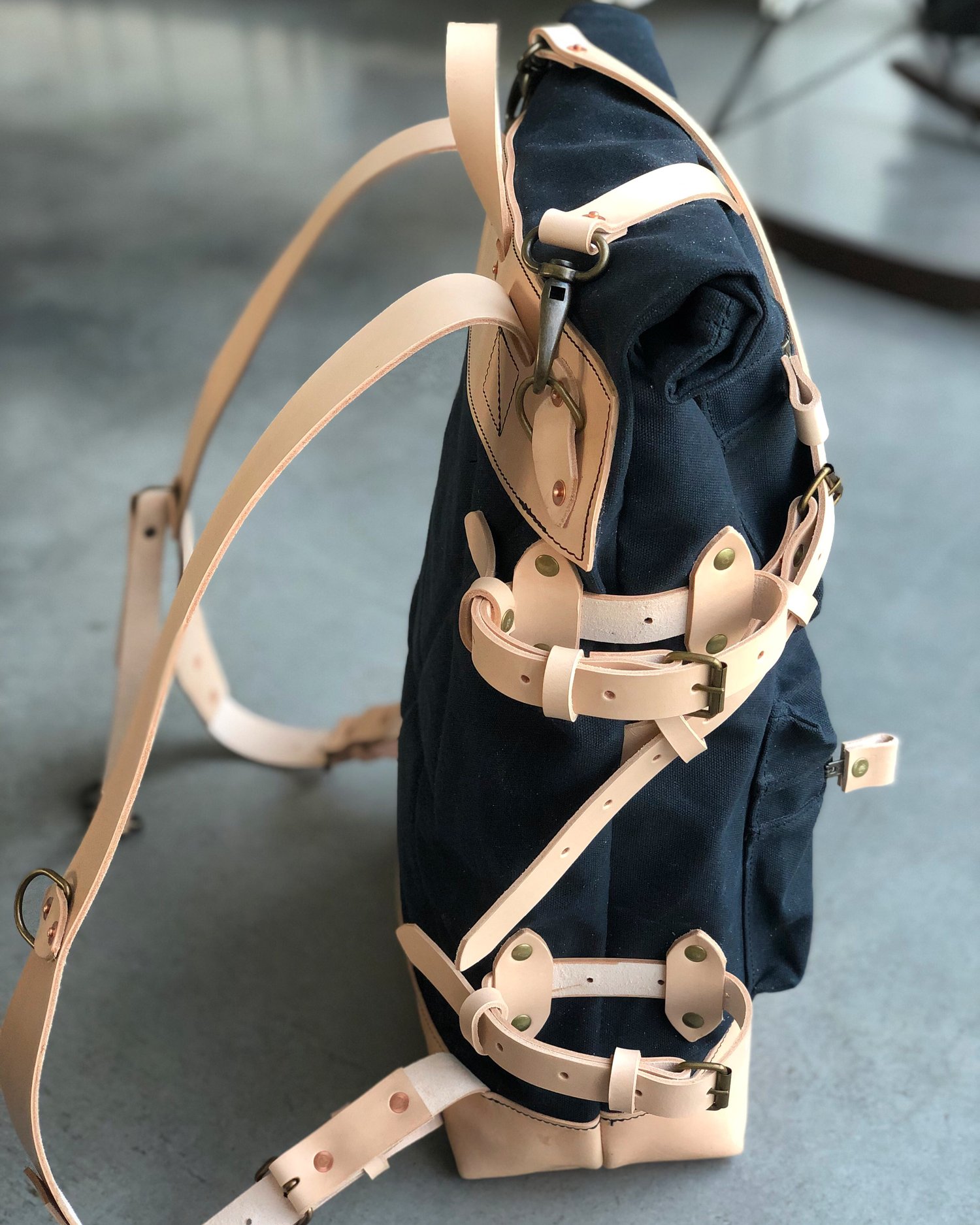 Image of Backpack made in waxed canvas and natural vegetable tanned leather with double zipper pocket