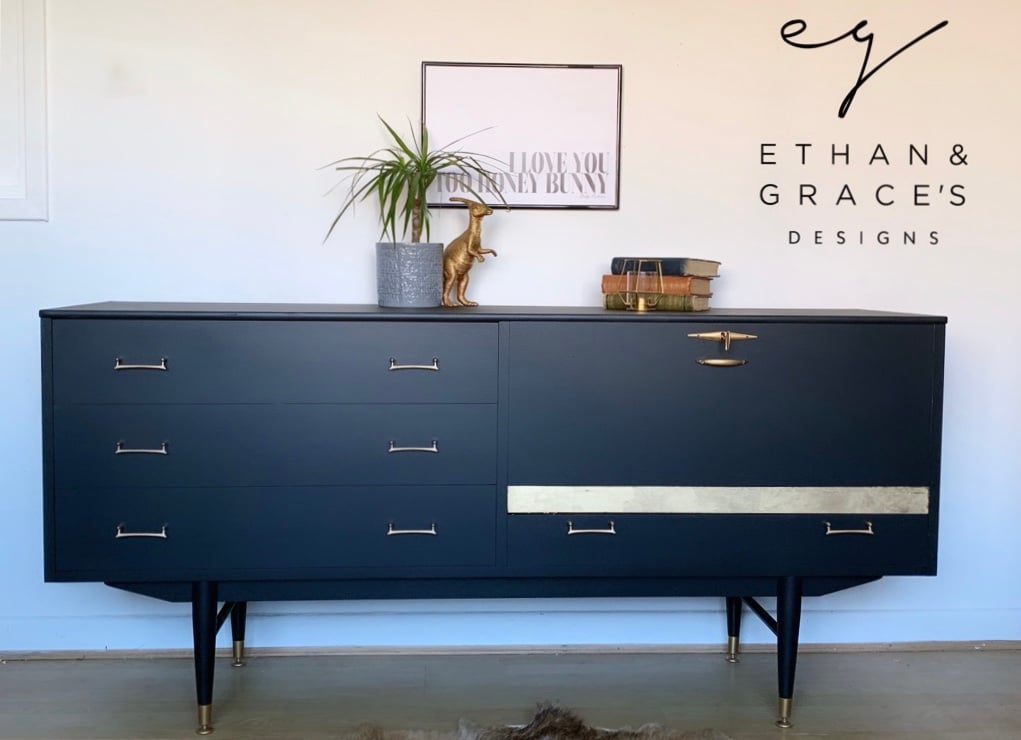 Image of A black and gold drinks sideboard with key.