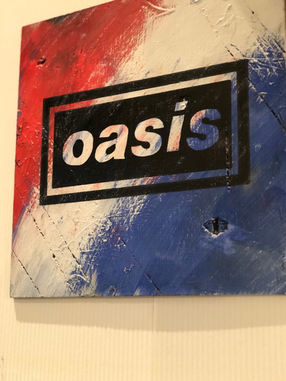 Oasis iconic logo hand painted on wood