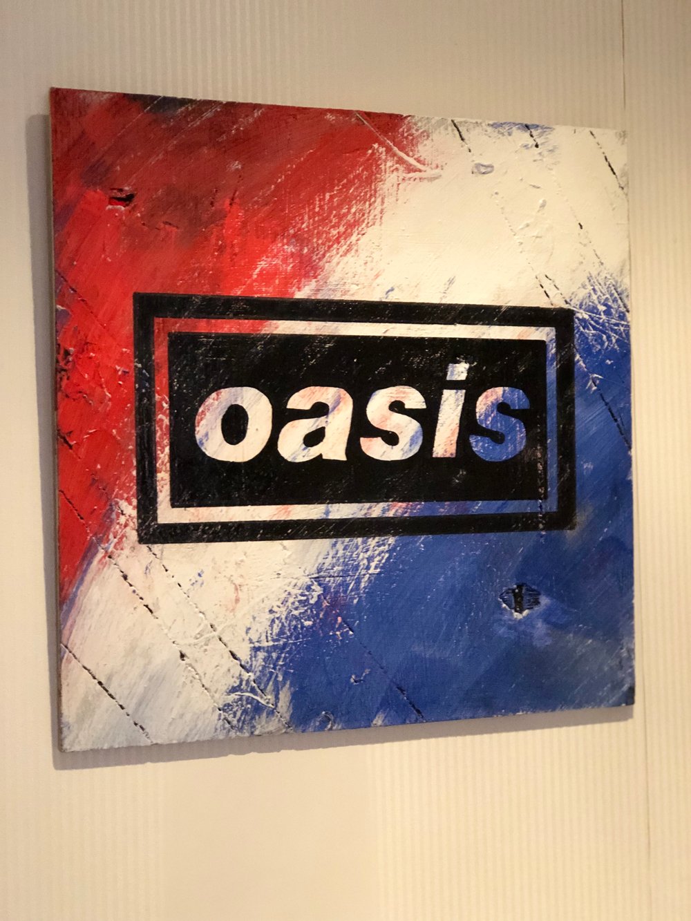Oasis iconic logo hand painted on wood