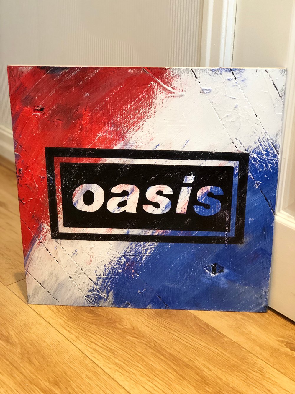 Oasis iconic logo hand painted on wood