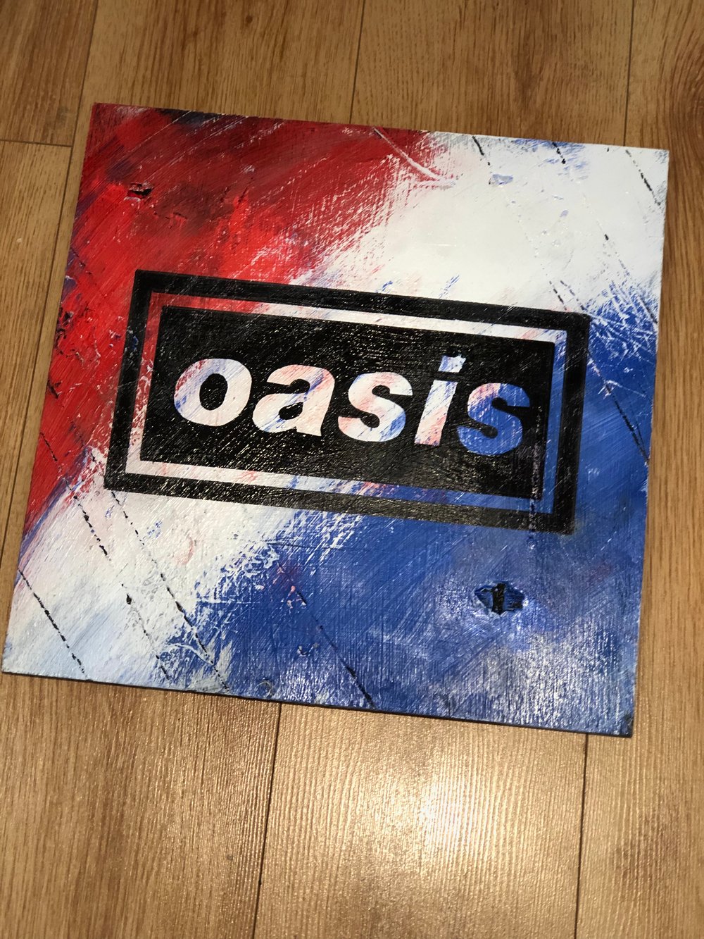 Oasis iconic logo hand painted on wood