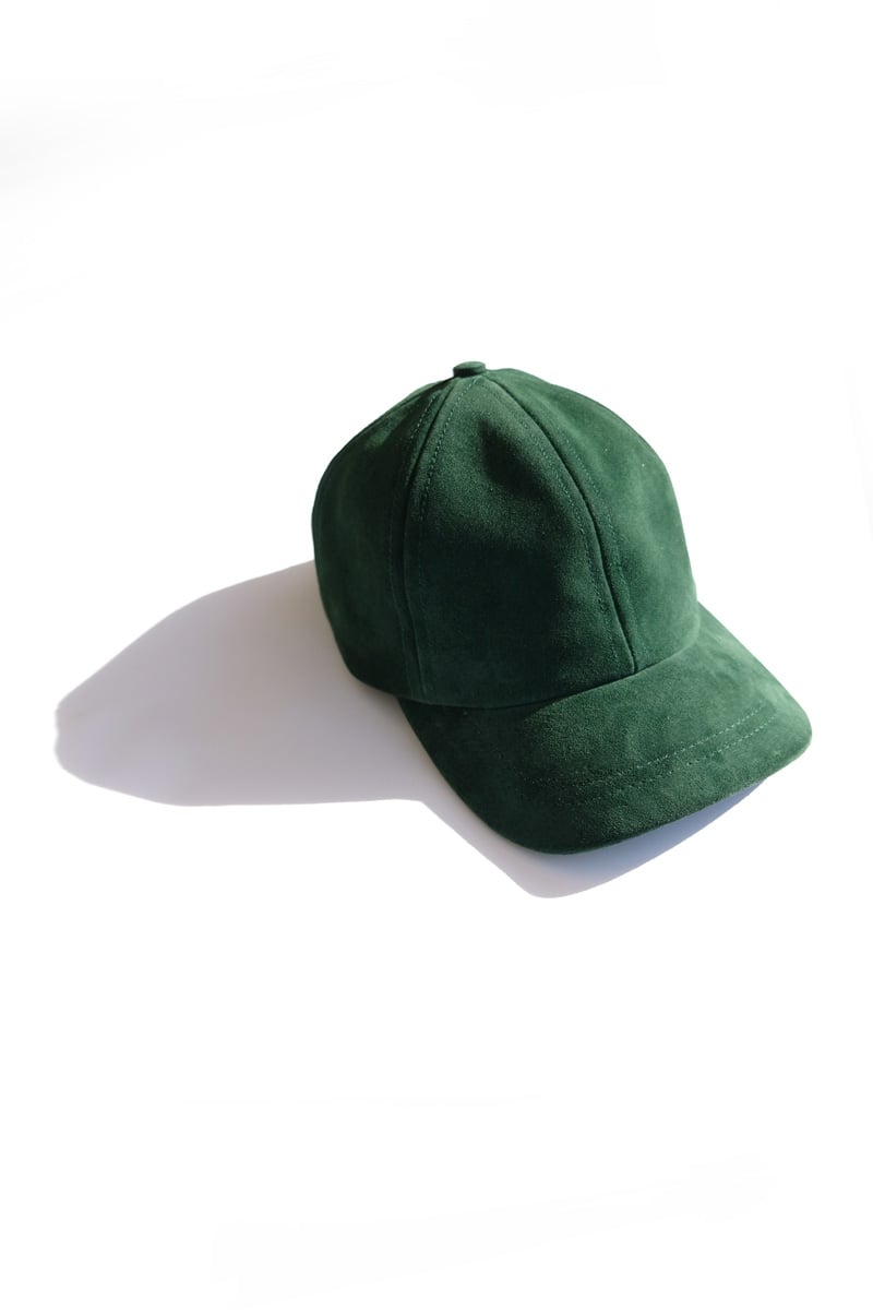 Image of forest green suede cap