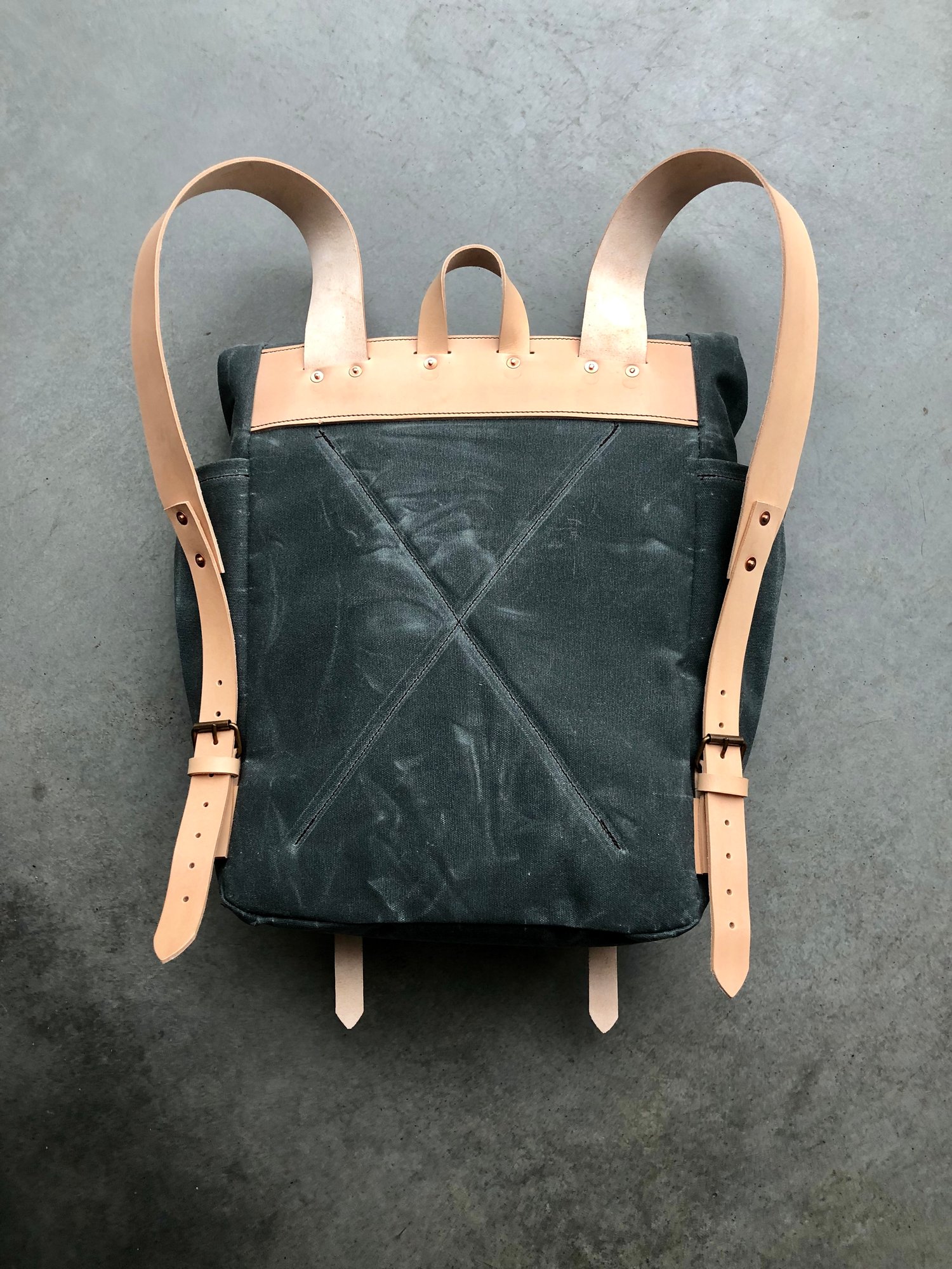 Image of Yoga backpack in waxed canvas with zipper pocket and double yoga straps