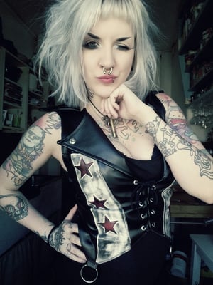 Image of fauxleather vest with stars and lightningbolts