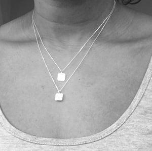 Image of Silver square hammered pendant with gold heart